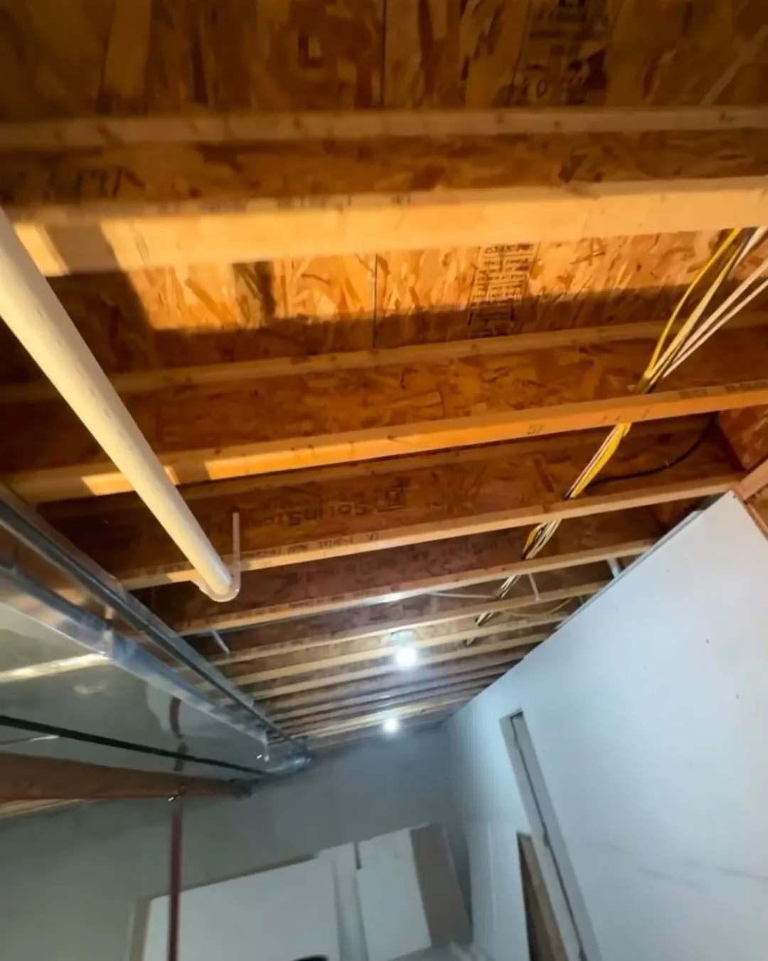Unfinished basement ceiling before