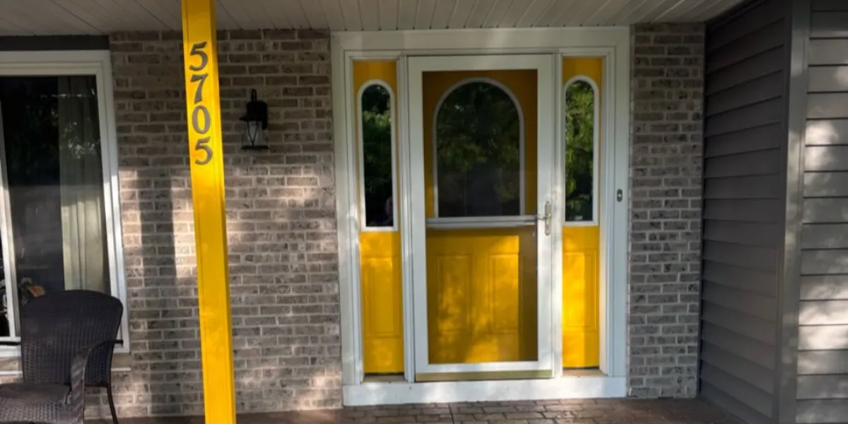 Yellow front door and sidelights before painting